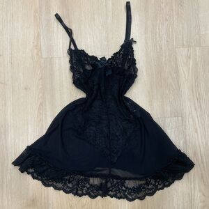 Yandy black mesh babydoll dress with lace trim and adjustable straps. Size: S